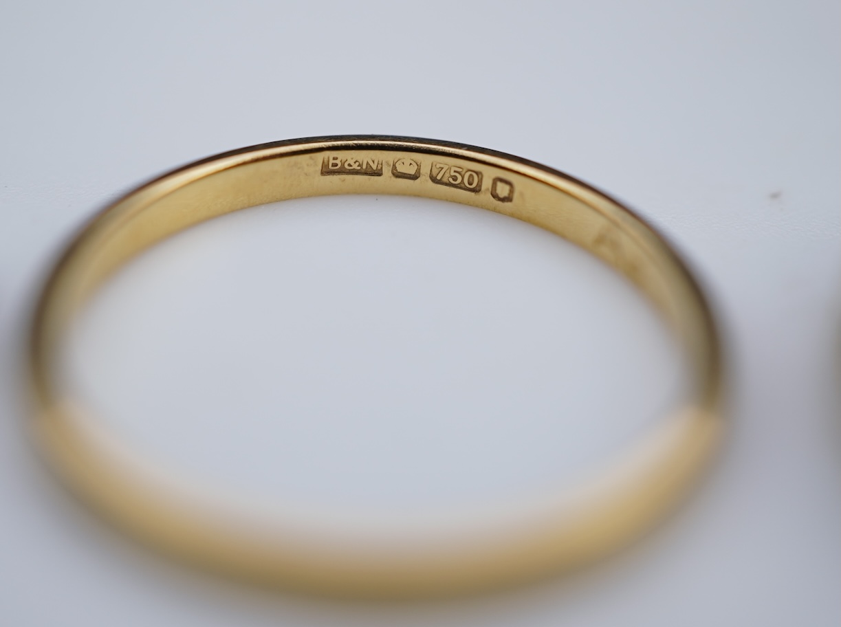 A diamond ring and two gold wedding rings